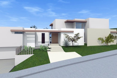 Example of a trendy white two-story stucco flat roof design in Los Angeles