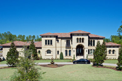 Mediterranean two-story stucco exterior home idea in Jacksonville