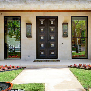Large transitional beige two-story mixed siding house exterior photo in Houston with a hip roof and a tile roof
