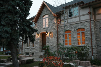 Trendy stone exterior home photo in Toronto