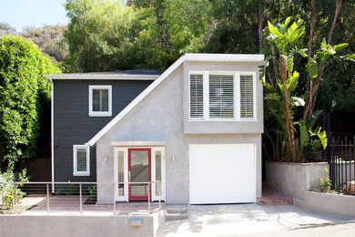 Small transitional gray two-story stucco exterior home photo in Los Angeles