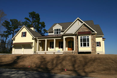 Inspiration for a large timeless two-story stone exterior home remodel in Raleigh
