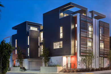 Inspiration for a mid-sized modern gray three-story concrete fiberboard exterior home remodel in Los Angeles