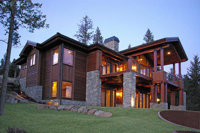 Large traditional gray two-story wood exterior home idea in Seattle