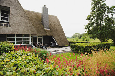Inspiration for a farmhouse two floor house exterior in Amsterdam.