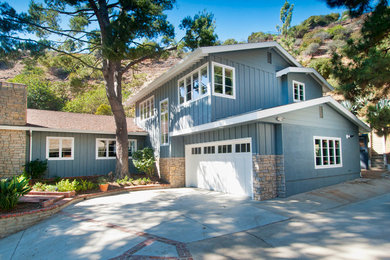 Large and blue traditional two floor detached house in Los Angeles with mixed cladding, a pitched roof and a shingle roof.