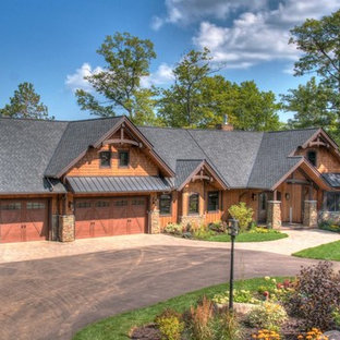 Example of a mountain style brown one-story mixed siding exterior home design in Minneapolis with a shingle roof