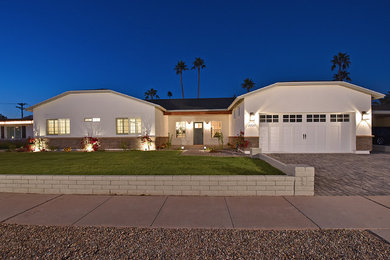 Example of a transitional exterior home design in Phoenix