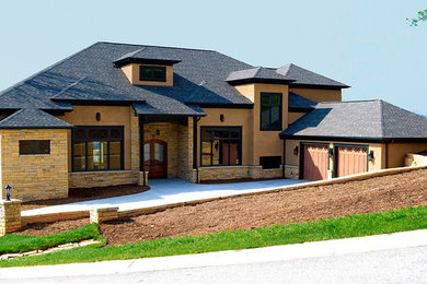 Large transitional brown three-story exterior home photo in Other