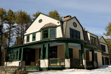 Design ideas for a beige house exterior in Portland Maine with wood cladding.