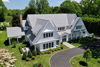 Large elegant white three-story exterior home photo