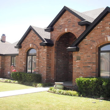 Black trimmed Brick home
