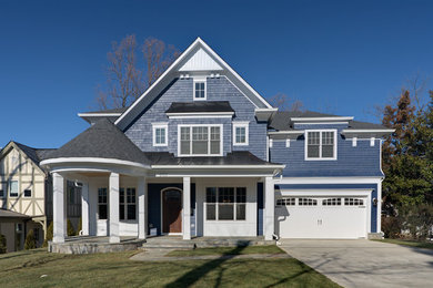 Example of a classic blue two-story wood exterior home design in DC Metro