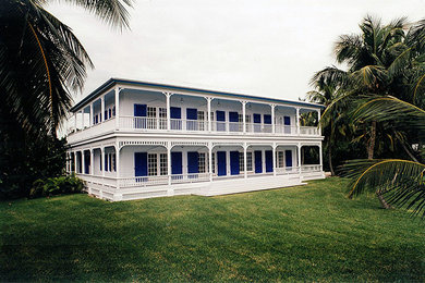 Design ideas for a white coastal two floor house exterior in Miami.
