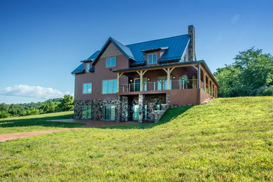 Example of a large arts and crafts three-story mixed siding exterior home design in Columbus