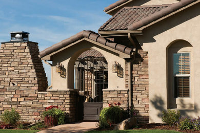 Southwest beige exterior home photo in New York with a tile roof