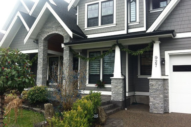 Inspiration for a large craftsman gray two-story wood exterior home remodel in Vancouver with a shingle roof