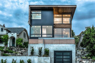 Example of a mid-sized minimalist three-story exterior home design in Seattle