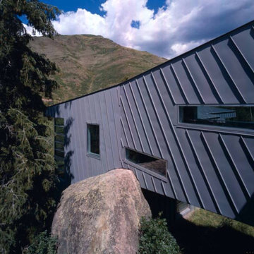 Boulder and Side View of Home