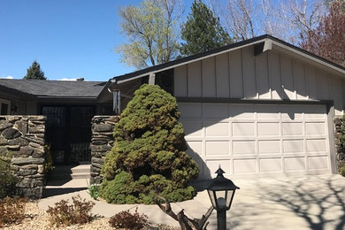 Photo of a medium sized and beige midcentury bungalow detached house in Denver with wood cladding, a pitched roof and a shingle roof.