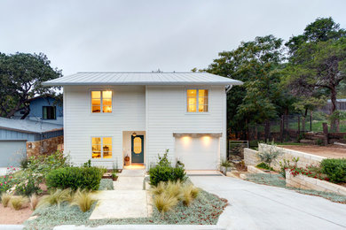 Large transitional white two-story wood exterior home idea in Austin
