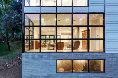 Example of a large transitional white two-story wood exterior home design in Austin