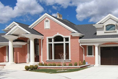 Inspiration for a mid-sized timeless red two-story brick gable roof remodel in Salt Lake City
