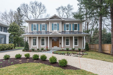 Inspiration for a large timeless beige two-story wood exterior home remodel in DC Metro
