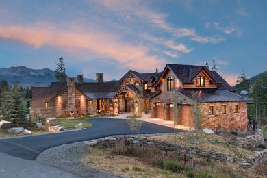 Example of a mountain style brown two-story mixed siding exterior home design in Denver