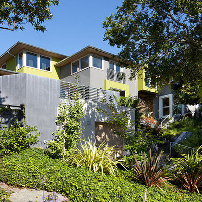 Large contemporary green two-story concrete exterior home idea in San Francisco