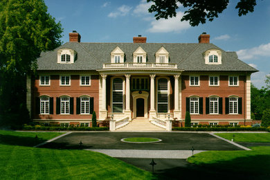 Example of a huge classic three-story brick exterior home design in Philadelphia with a shed roof