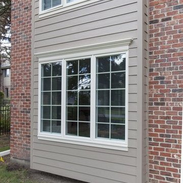 Brick exterior paired with James Hardie Siding, GAF Roof & Andersen Windows