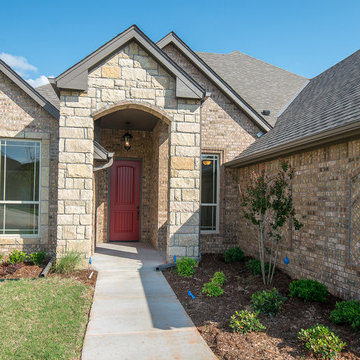 Brick Home with Stone Accents and Red Front Door