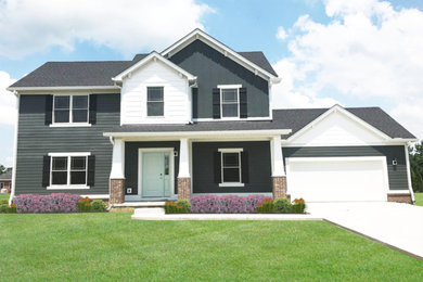 Mid-sized gray two-story vinyl house exterior idea in Indianapolis with a shingle roof