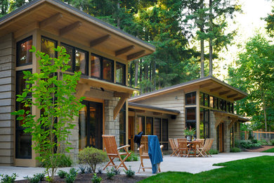 Large craftsman gray two-story mixed siding house exterior idea in Seattle with a shed roof and a metal roof