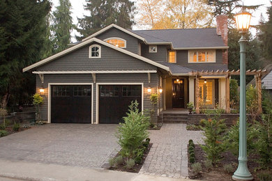 Inspiration for a mid-sized timeless gray two-story mixed siding house exterior remodel in Seattle with a hip roof and a shingle roof