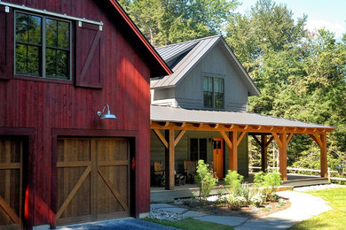 Gey rural two floor house exterior in Burlington with wood cladding.