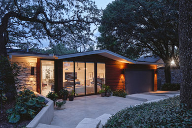 Diseño de fachada de casa moderna pequeña con revestimiento de madera