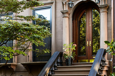 Inspiration for a timeless three-story townhouse exterior remodel in New York