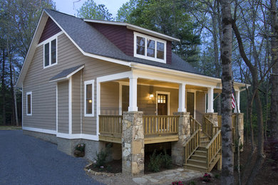 Arts and crafts stone exterior home photo in Other