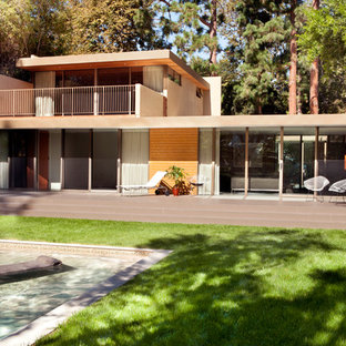 Example of a 1960s wood flat roof design in Los Angeles