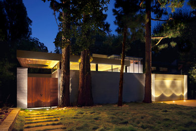 Inspiration for a 1950s concrete exterior home remodel in Los Angeles
