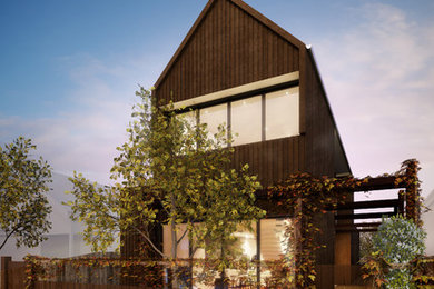 Diseño de fachada marrón contemporánea pequeña de dos plantas con revestimientos combinados y tejado a dos aguas