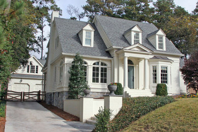 Example of a mid-sized classic white two-story vinyl exterior home design in Atlanta with a shingle roof