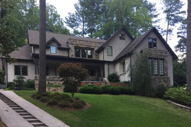Mid-sized contemporary beige two-story mixed siding gable roof idea in Atlanta