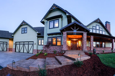 Huge craftsman green two-story mixed siding exterior home idea in Other