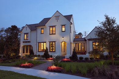 Inspiration for a large timeless white two-story exterior home remodel in Orlando