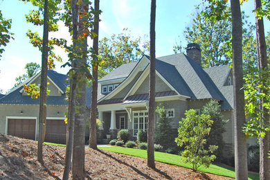 Example of a large classic gray three-story wood house exterior design in Charlotte with a mixed material roof