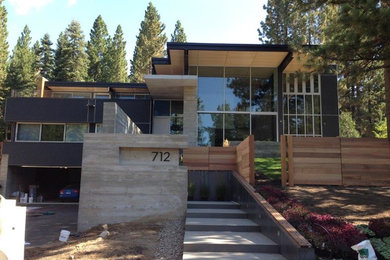 Modern three-story mixed siding exterior home idea in Sacramento with a mixed material roof