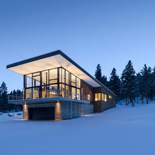 Large minimalist multicolored two-story mixed siding house exterior photo in Denver with a shed roof